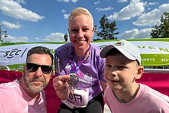 Happy at the finish line with her family